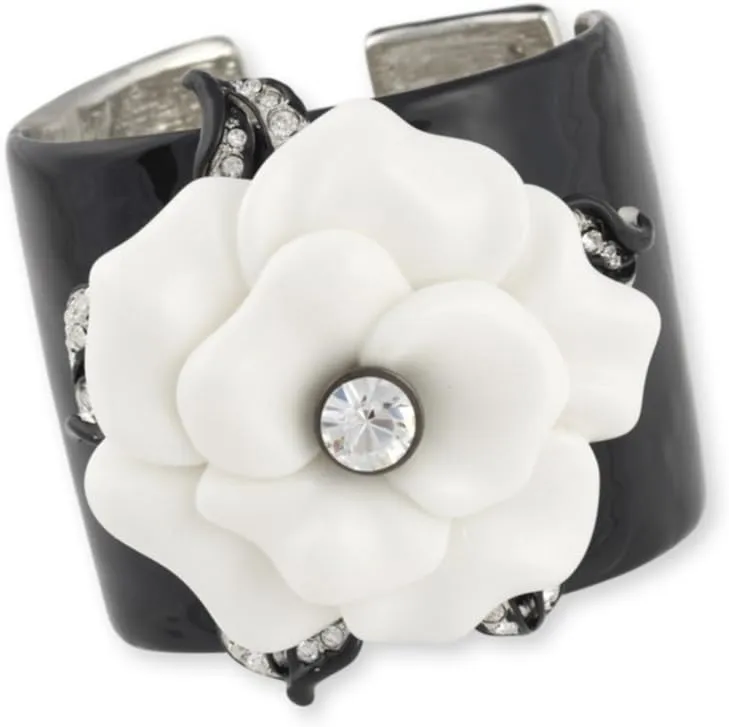 KENNETH JAY LANE, BLACK ENAMEL CUFF WITH WHITE FLOWER ACCENT
