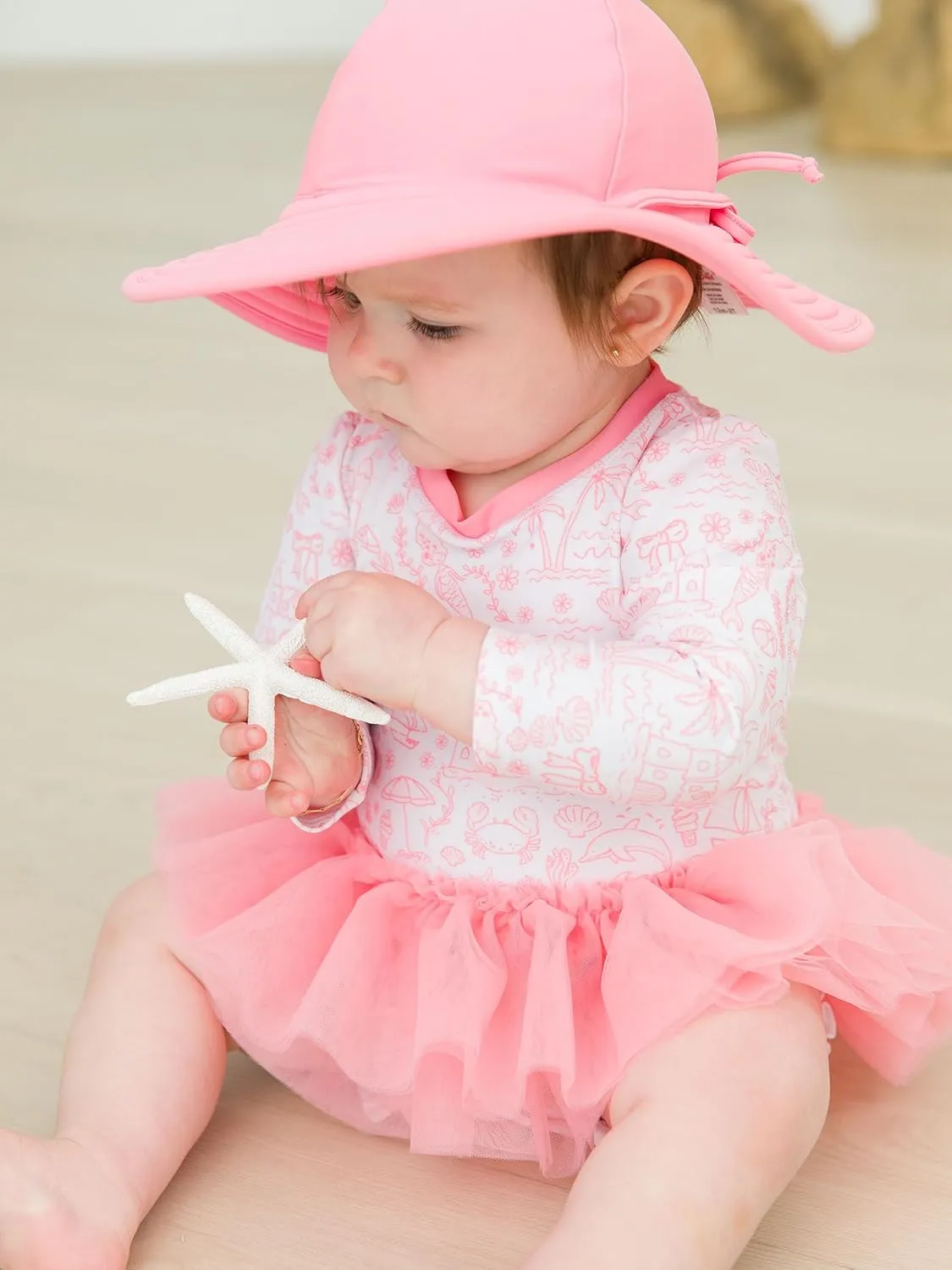 RuffleButts Baby Girls UPF 50  Sun Protection Tulle Skirted Long Sleeve One Piece Rash Guard Swimsuit