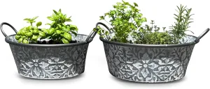 WHW Whole House Worlds Rustic Metal Planters, Set of 2, Floral Pattern, White Washed Finish, Metal, Cache Pot Jardinieres, Distressed Grey Finish, 14.5 and 12.5 Diameter